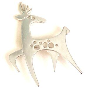 Jaunty midcentury figural brooch signed C&M